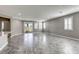 A bright living room boasts neutral tones, tile floors, and backyard access at 3122 Berceto Ct, Henderson, NV 89044
