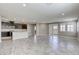 An expansive living space features an open kitchen, tile floors, and neutral tones at 3122 Berceto Ct, Henderson, NV 89044