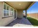 Covered patio with brick flooring, sliding glass doors, and a view of the backyard at 3122 Berceto Ct, Henderson, NV 89044