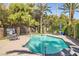 Inviting community pool area with lounge chairs, mature trees, and refreshing blue water for relaxing and recreation at 3135 S Mojave Rd # 146, Las Vegas, NV 89121