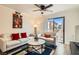 Bright living room with neutral decor, modern furnishings, and sliding glass doors to the outside at 3135 S Mojave Rd # 146, Las Vegas, NV 89121