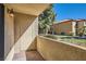 Private outdoor patio with views of landscaping and nearby residential buildings at 3135 S Mojave Rd # 146, Las Vegas, NV 89121