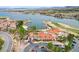 Aerial view showcasing the community clubhouse near a lake and golf course at 33 Reverie Heights Ave, Henderson, NV 89011