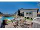 Inviting backyard with patio area, outdoor dining, and pool at 33 Reverie Heights Ave, Henderson, NV 89011