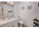 Bathroom featuring a single vanity, toilet, and decorative accents at 33 Reverie Heights Ave, Henderson, NV 89011