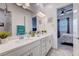 Bathroom with double sinks, lots of vanity space, and an open view to the bedroom at 33 Reverie Heights Ave, Henderson, NV 89011