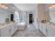 Bright bathroom with double sinks, a soaking tub, and glass-enclosed shower at 33 Reverie Heights Ave, Henderson, NV 89011