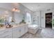 Bright bathroom with double vanities, soaking tub, and glass shower at 33 Reverie Heights Ave, Henderson, NV 89011