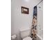 Cozy bathroom with white fixtures, shower, tub, and framed artwork at 33 Reverie Heights Ave, Henderson, NV 89011