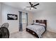Bedroom with ceiling fan, a large window, and tasteful decor for comfortable living at 33 Reverie Heights Ave, Henderson, NV 89011
