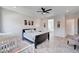 Bright main bedroom with tile floors, modern decor, and natural light at 33 Reverie Heights Ave, Henderson, NV 89011