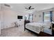 Bright main bedroom with ceiling fan and natural light from the window at 33 Reverie Heights Ave, Henderson, NV 89011