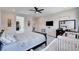 Well-lit main bedroom with stylish decor, ceiling fan, and closet access at 33 Reverie Heights Ave, Henderson, NV 89011