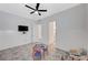 A cozy bedroom with a ceiling fan and table at 33 Reverie Heights Ave, Henderson, NV 89011