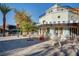 Charming exterior of a waterfront cafe with blue accents and outdoor seating at 33 Reverie Heights Ave, Henderson, NV 89011
