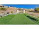 Community park featuring desert landscaping, pergola, and artificial grass at 33 Reverie Heights Ave, Henderson, NV 89011