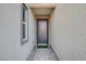 Stylish entryway with a modern door, sleek sidelight window, and a welcoming walkway at 33 Reverie Heights Ave, Henderson, NV 89011