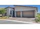 Contemporary home with a two-car garage, low-maintenance front yard, and modern architectural design at 33 Reverie Heights Ave, Henderson, NV 89011