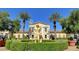 Statue of Neptune in front of yellow building with palm trees at 33 Reverie Heights Ave, Henderson, NV 89011