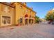 Charming storefront with awning and outdoor seating along a brick-paved walkway at 33 Reverie Heights Ave, Henderson, NV 89011