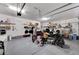 Spacious and organized garage interior with ample storage, epoxy floors, and room for multiple vehicles and accessories at 33 Reverie Heights Ave, Henderson, NV 89011
