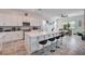 Gourmet kitchen featuring a large island with seating and stainless steel appliances at 33 Reverie Heights Ave, Henderson, NV 89011