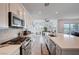 Spacious kitchen showcasing a large island, stainless steel appliances, and open layout at 33 Reverie Heights Ave, Henderson, NV 89011