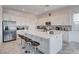 Modern kitchen with large island, stainless steel appliances, and ample counter space at 33 Reverie Heights Ave, Henderson, NV 89011