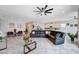 Spacious open living area with tile floors, a comfortable sectional, and a stylish seating arrangement at 33 Reverie Heights Ave, Henderson, NV 89011