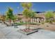 Community park featuring manicured landscaping, mature trees, seating, and a picnic pavilion at 33 Reverie Heights Ave, Henderson, NV 89011