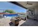 Relaxing outdoor patio features a pool with an integrated water feature at 33 Reverie Heights Ave, Henderson, NV 89011