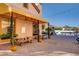 Charming outdoor patio with string lights, tables, and views of the lake and mountains at 33 Reverie Heights Ave, Henderson, NV 89011