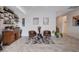 Inviting sitting area with two leather chairs, unique glass table, and decorative shelving at 33 Reverie Heights Ave, Henderson, NV 89011