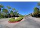 Scenic street view with lush landscaping and architectural monument at 33 Reverie Heights Ave, Henderson, NV 89011