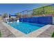 Sparkling swimming pool with a mosaic waterfall feature at 33 Reverie Heights Ave, Henderson, NV 89011