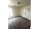 Neutral bedroom featuring a window, carpet and closet at 3425 Palatine Hills Ave, North Las Vegas, NV 89081