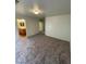 Bedroom with neutral colored walls and carpet leading to the bathroom at 3425 Palatine Hills Ave, North Las Vegas, NV 89081
