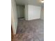 Bedroom with neutral colored walls and carpet leading to a hallway at 3425 Palatine Hills Ave, North Las Vegas, NV 89081