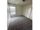 Neutral bedroom featuring a window, carpet and closet at 3425 Palatine Hills Ave, North Las Vegas, NV 89081
