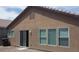 Exterior of home featuring windows and a sliding glass door at 3425 Palatine Hills Ave, North Las Vegas, NV 89081