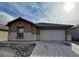 Inviting single-story home with a two-car garage and low-maintenance landscaping at 3425 Palatine Hills Ave, North Las Vegas, NV 89081