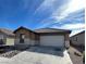 Inviting single-story home with a two-car garage and low-maintenance landscaping at 3425 Palatine Hills Ave, North Las Vegas, NV 89081