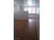 Living room area with hardwood floors and views into the home and backyard at 3425 Palatine Hills Ave, North Las Vegas, NV 89081