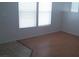 Comfortable living room features attractive flooring and ample natural light from windows at 3425 Palatine Hills Ave, North Las Vegas, NV 89081