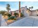 Home with stucco exterior, tile roof, 3-car garage and desert landscaping at 3540 Wisdom Ct, Las Vegas, NV 89120