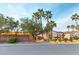 Beautiful home exterior featuring desert landscaping, mature trees and a tile roof at 3540 Wisdom Ct, Las Vegas, NV 89120