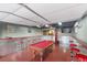 Inside the converted garage features a pool table, bar, and TV for recreation and entertainment at 3540 Wisdom Ct, Las Vegas, NV 89120