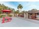 Spacious backyard with a garage converted into a game room, complete with bar, pool table, and festive decor at 3540 Wisdom Ct, Las Vegas, NV 89120