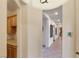 Hallway featuring tile floors, recessed lighting, and an open view of the pantry at 3540 Wisdom Ct, Las Vegas, NV 89120