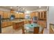 Gourmet kitchen with custom cabinets, granite countertops and stainless steel appliances at 3540 Wisdom Ct, Las Vegas, NV 89120